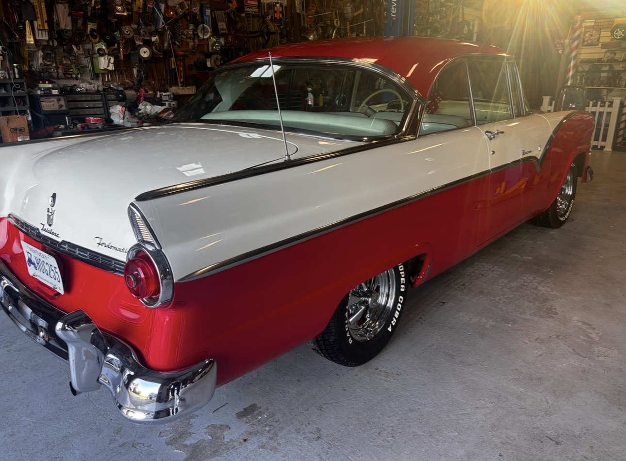 Red and white classic Ford Fairlane after detailing