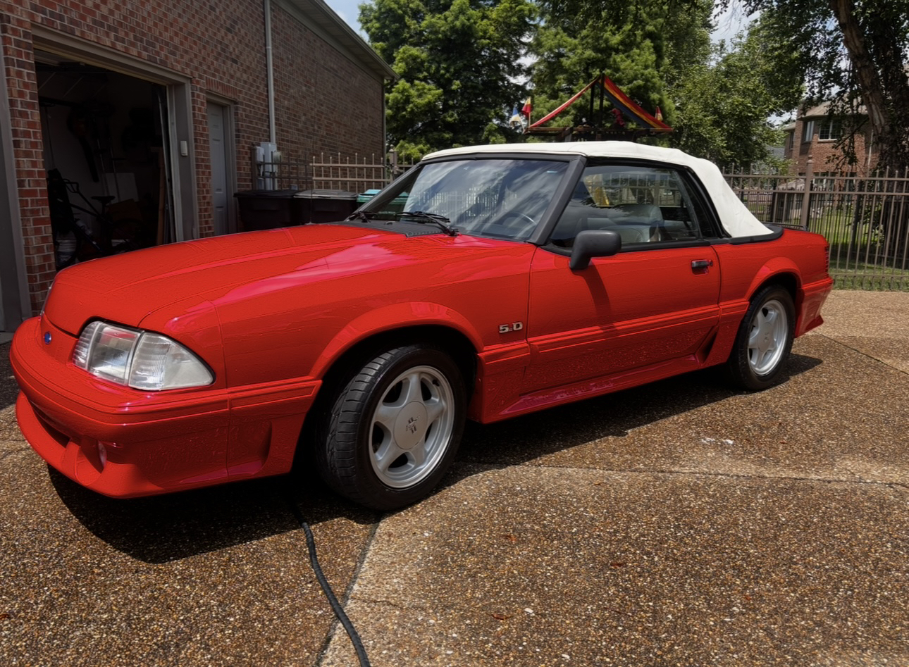Red Ford Mustang convertible after detailing